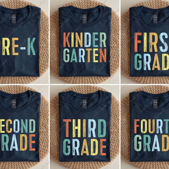Set of six navy blue t-shirts with colorful grade-level text on a woven surface.