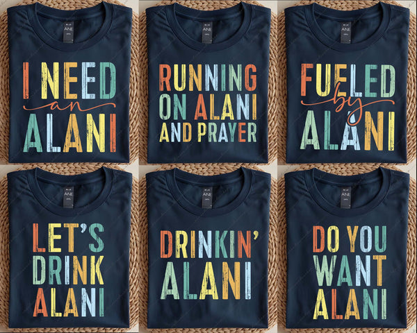 Six black t-shirts with colorful text on a woven surface