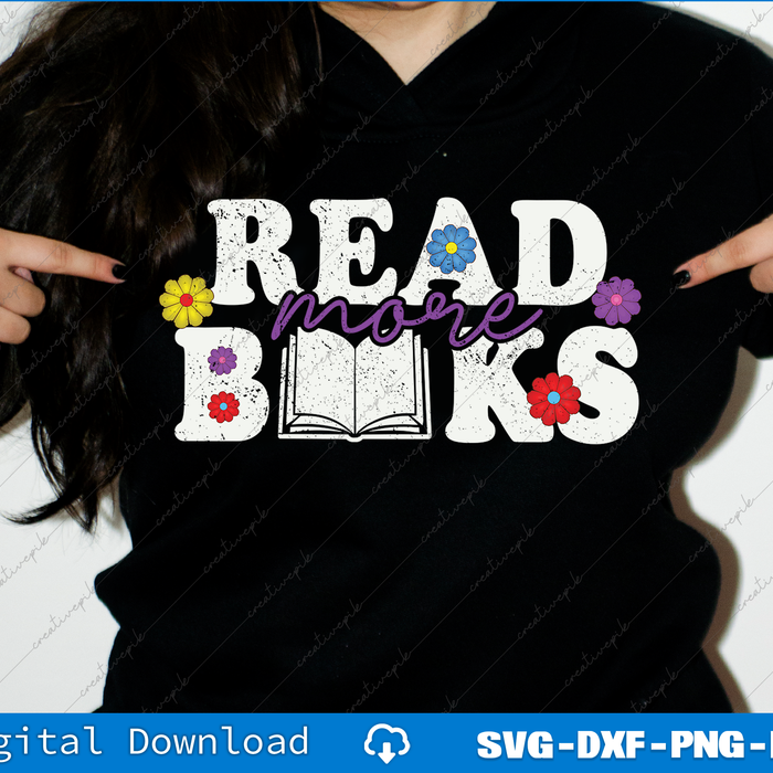 Black t-shirt with 'Read more books' text and flowers, pointed at by two hands.
